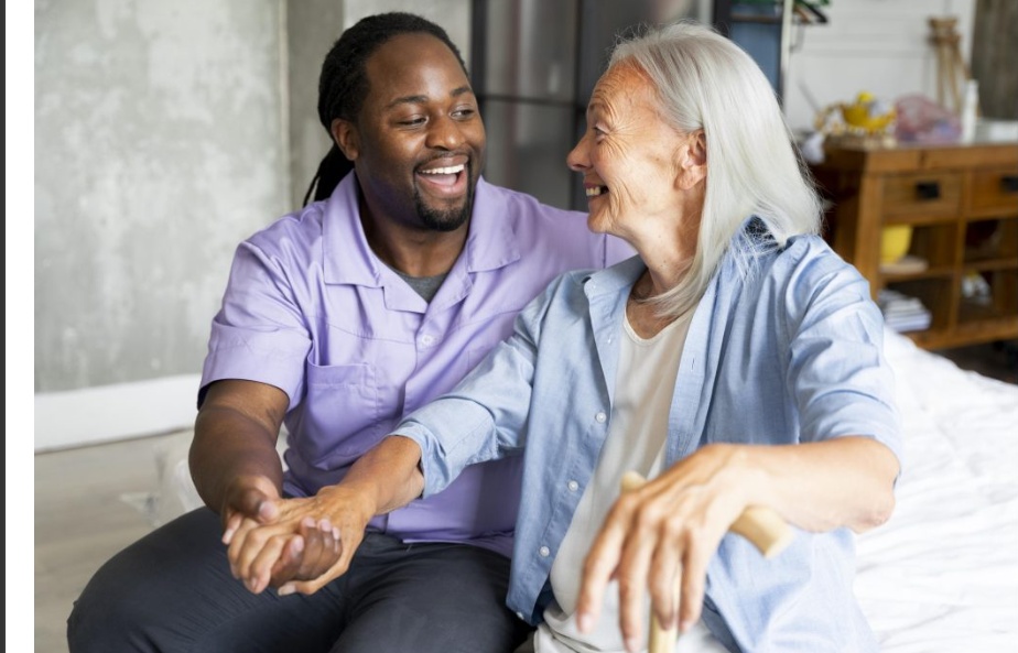 A support worker and older woman enjoying a conversation